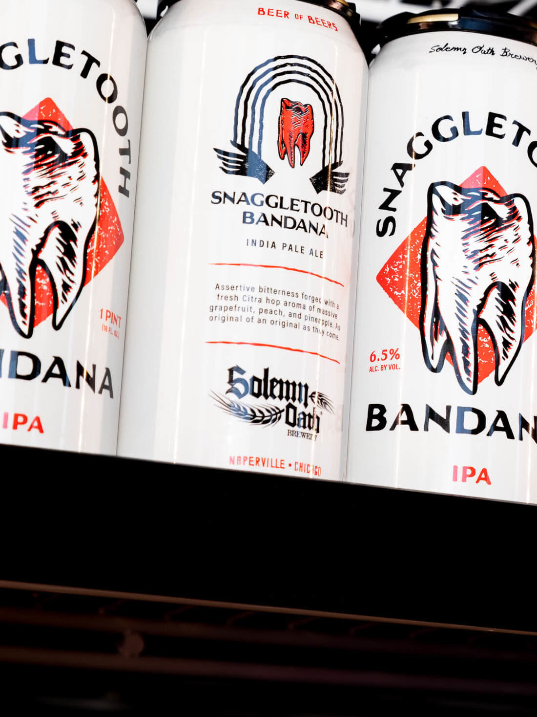 Stout Collective Website – Solemn Oath Brewery Flagship Rebrand Snaggletooth Bandana Cans